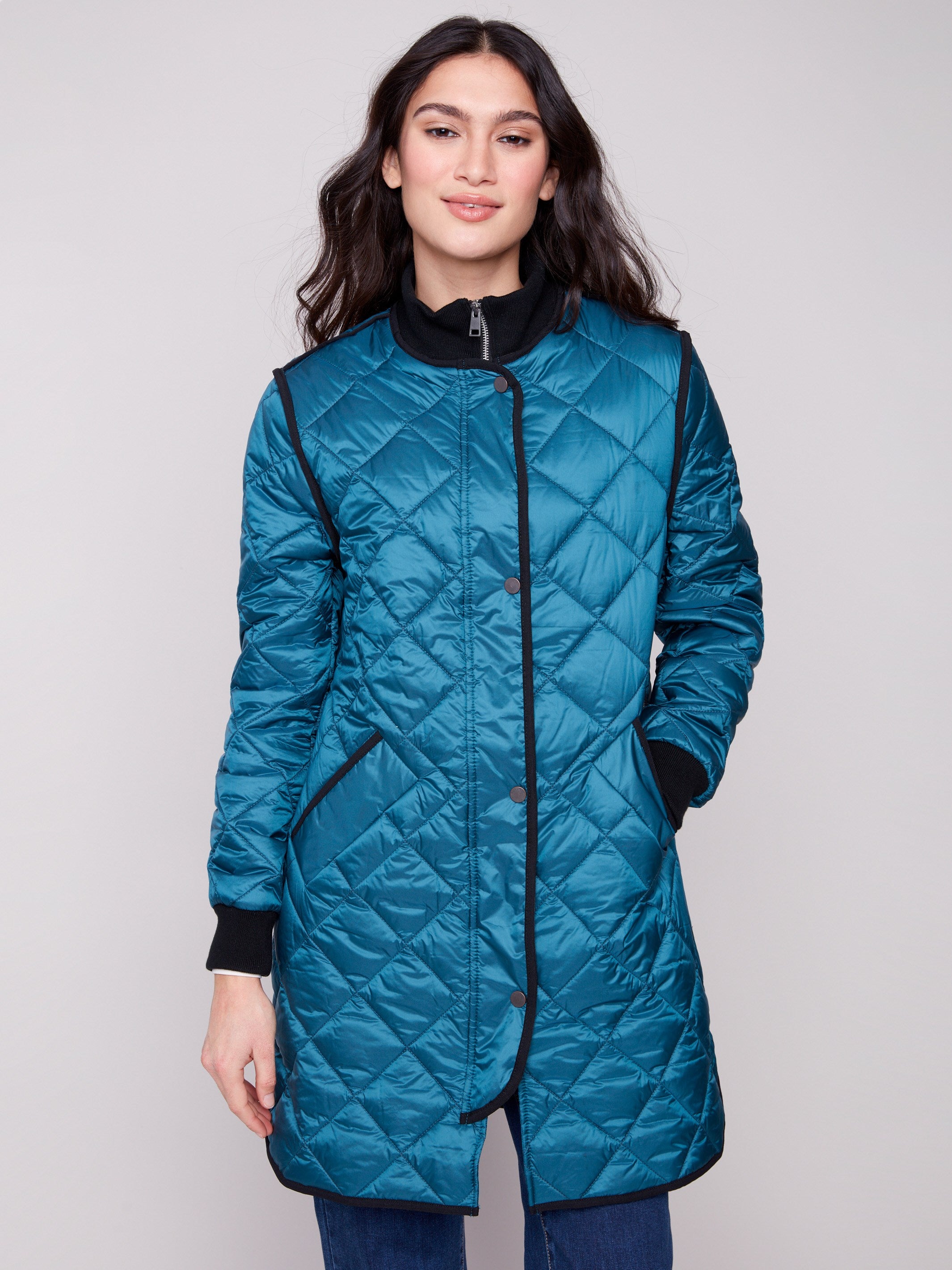Long puffer jacket in evergreen featuring a secure zipper front and snap buttons for added convenience by Charlie B.