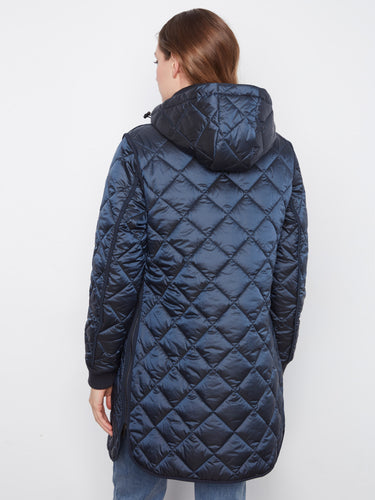 Welt pockets add practicality to this chic quilted coat, ideal for carrying small essentials while on the go by Charlie B.