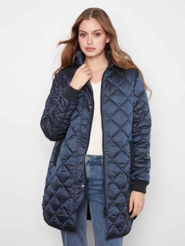 Ribbed knit details provide added warmth and texture to this stylish outerwear piece, making it a wardrobe staple by Charlie B.