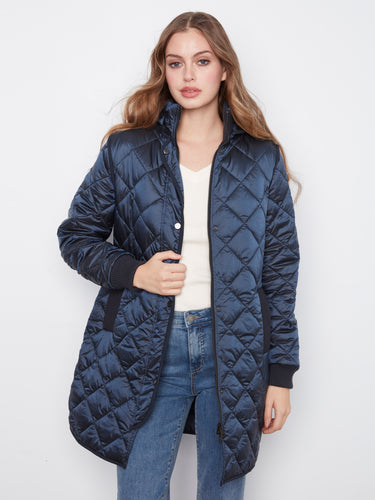 Secure front zip closure with additional snap buttons ensures warmth and style throughout the colder months by Charlie B.