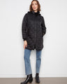 Chic quilted coat with a removable hood for versatile styling. Perfect for changing weather, it offers both style and function by Charlie B.