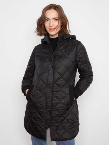 Stylish black coat featuring welt pockets, adding convenience and elegance to your look. A must-have addition to any wardrobe by Charlie B.