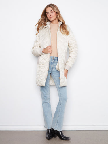 Stay cozy in this quilted coat with its practical removable hood. Ideal for layering on cooler days by Charlie B.