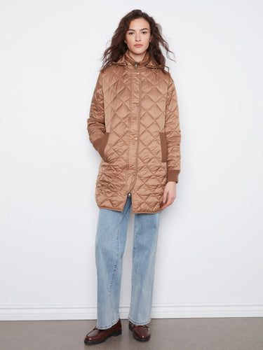 Truffle-colored puffer jacket featuring a removable hood, quilted pattern, and ribbed cuffs. Zip closure adds style by Charlie B.