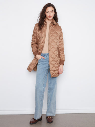 Chic truffle puffer jacket with front zip closure and snap buttons for a secure fit. Ribbed cuffs complete it by Charlie B.