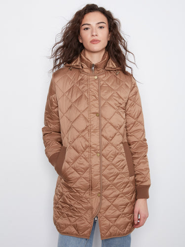 Quilted truffle puffer coat featuring stylish details like welt pockets and side zippers for versatility by Charlie B.