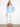 Scuba top in light blue with relaxed fit and delicate soutache accents on sleeves. Drop shoulders complete the look by Charlie B.