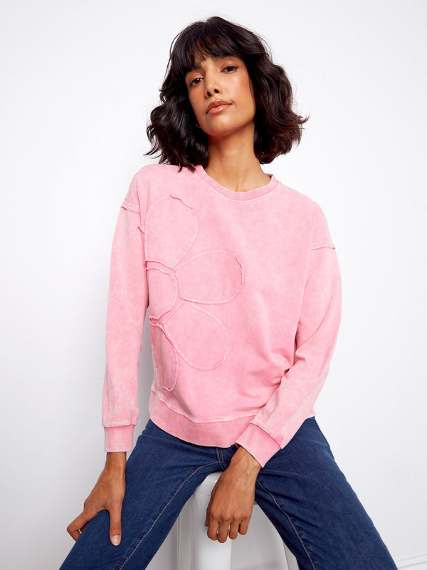 Pink sweatshirt with ribbed neck, hem and cuffs ensuring a snug fit while maintaining style and comfort by Charlie B.