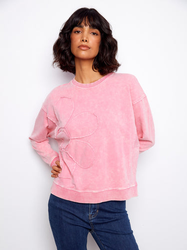 Beautifully designed pink top with crew neckline offers timeless elegance and comfort in one piece by Charlie B.