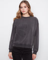 Charcoal top featuring drop shoulders and floral applique, crafted from stretch cotton by Charlie B.