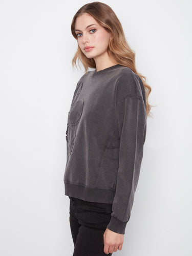 Elegant charcoal top showcasing ribbed details and a charming flower applique by Charlie B.