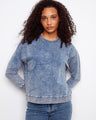Blue sweatshirt with a crew neckline and a subtle flower applique design, offering a stylish touch to casual wear by Charlie B.