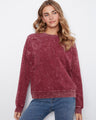 This garment features a floral appliqué detail, adding a touch of elegance to the stretch cotton fabric by Charlie B.
