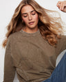 The ribbed neck, hem, and cuffs provide a snug fit while maintaining comfort throughout the day by Charlie B.