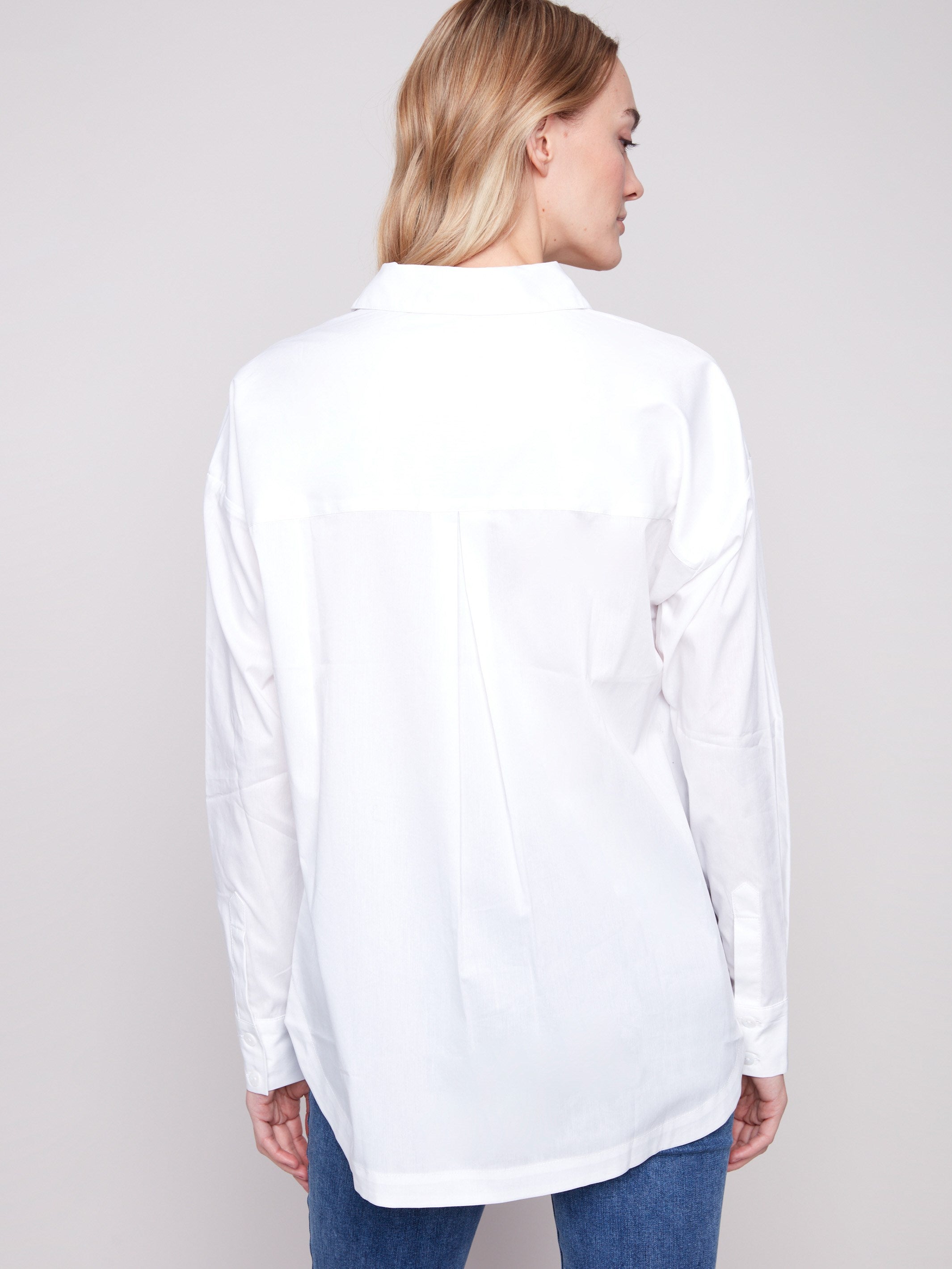 Chic white poplin shirt showcasing a button-down design for effortless style by Charlie B.