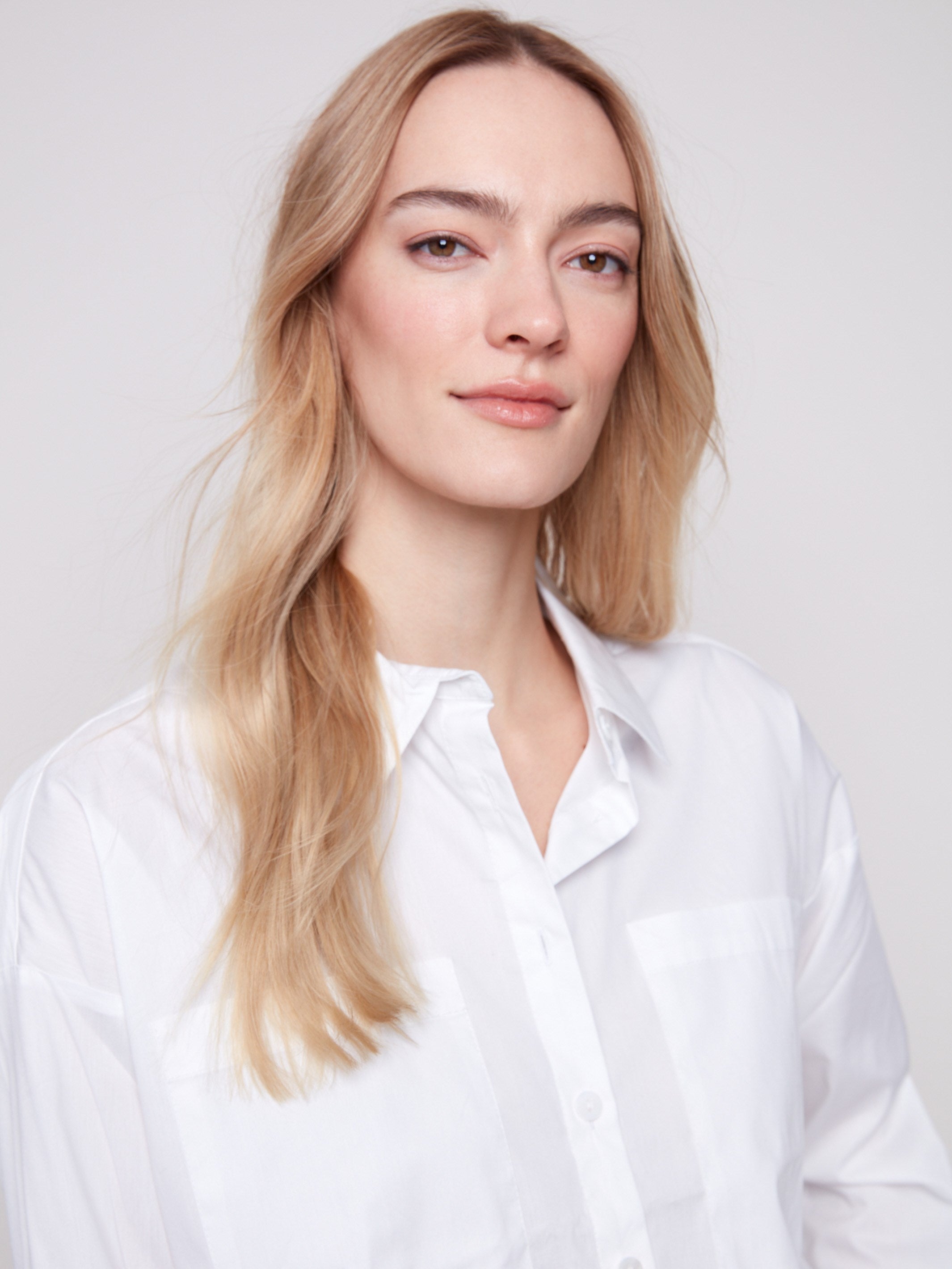 Stylish long-sleeve poplin shirt highlighted by functional chest pockets, ideal for everyday wear by Charlie B.