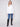 White long-sleeve poplin shirt with chest pockets and button-up front by Charlie B.