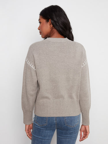 Long sleeves provide warmth and versatility, making this sweater an ideal choice for cooler days by Charlie B.