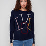 Navy sweater with colorful 'LOVE' embroidery, showcasing a relaxed drop shoulder fit and ribbed cuffs for added style by Charlie B.