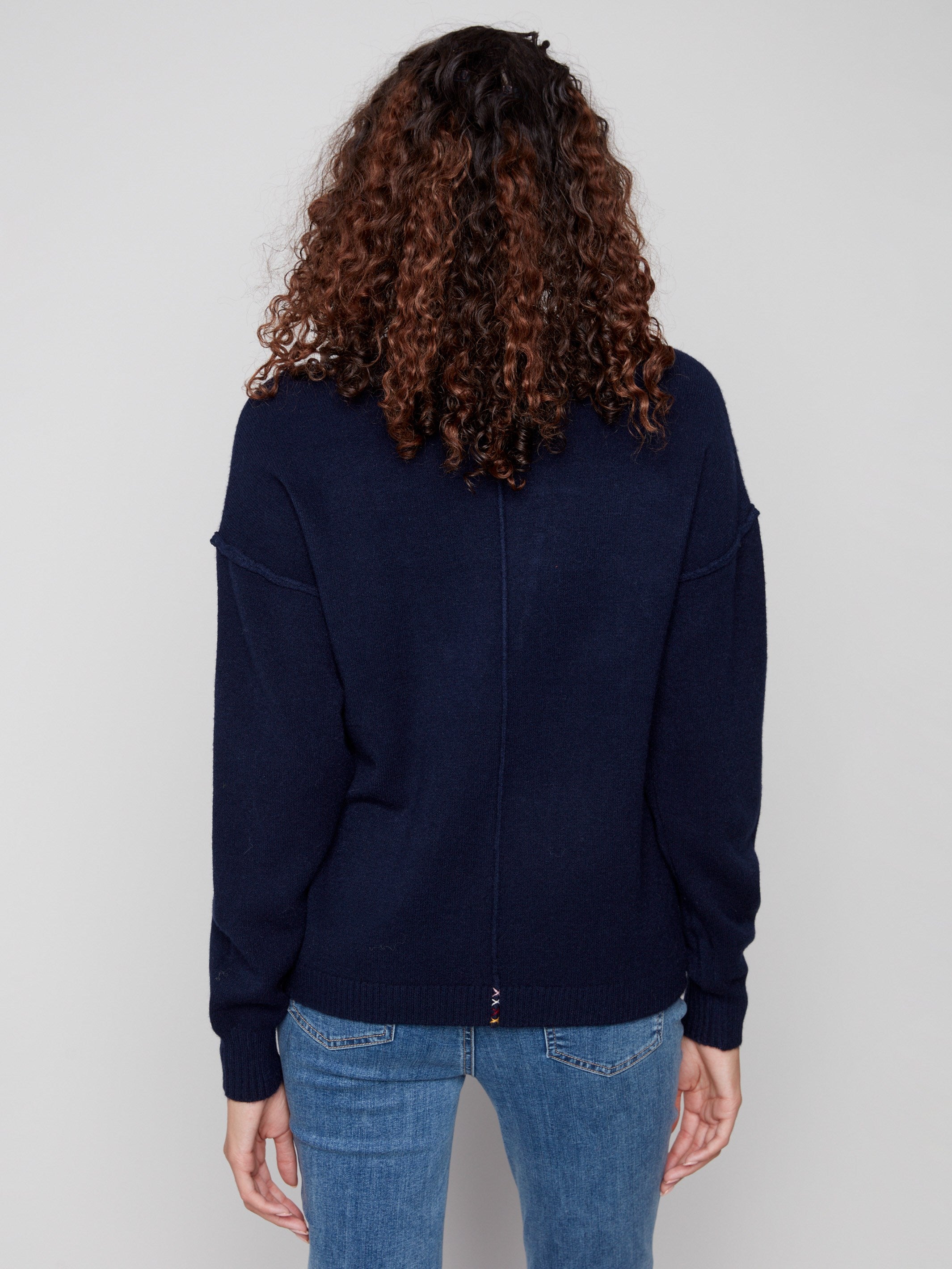 Classic navy sweater highlighted by intricate 'LOVE' soutache embroidery, offering a chic drop shoulder look by Charlie B.