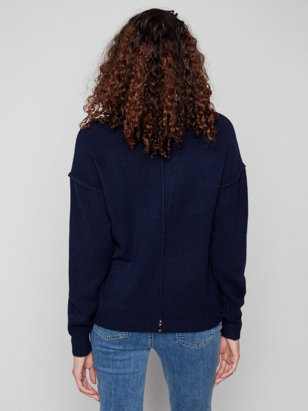 Classic navy sweater highlighted by intricate 'LOVE' soutache embroidery, offering a chic drop shoulder look by Charlie B.