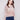 Latte-colored V-neck sweater featuring drop shoulders and a textured knit for a relaxed fit by Charlie B.