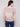Elegant sweater in latte hue showcasing intricate open knit sleeves, perfect for layering by Charlie B.