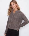 Sweater crafted with metallic flecked yarn, adding a touch of sparkle by Charlie B.