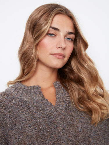 Soft grey speckled texture adds depth to this cable knit piece by Charlie B.