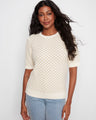 This stylish top features a crew neck design, perfect for casual outings or layering with your favorite jacket. By Charlie B.