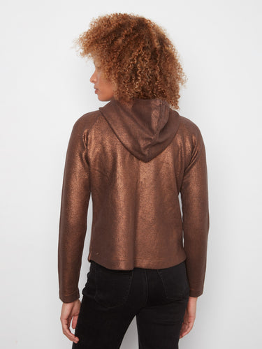 Experience the comfort of this copper knit hoodie with raglan sleeves, perfect for layering during cooler seasons by Charlie B.