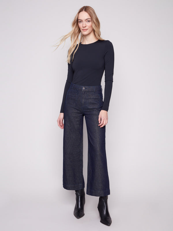 Cropped blue black jeans with a regular rise and subtle metallic finish, featuring front patch pockets by Charlie B.