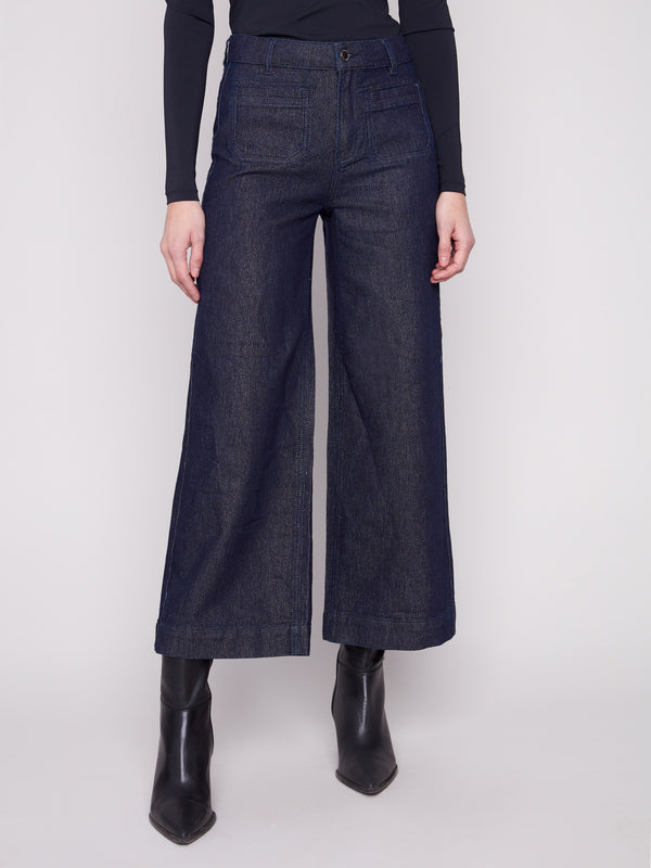 Blue black jeans in a flare fit, crafted from stretch denim for comfort and style by Charlie B.