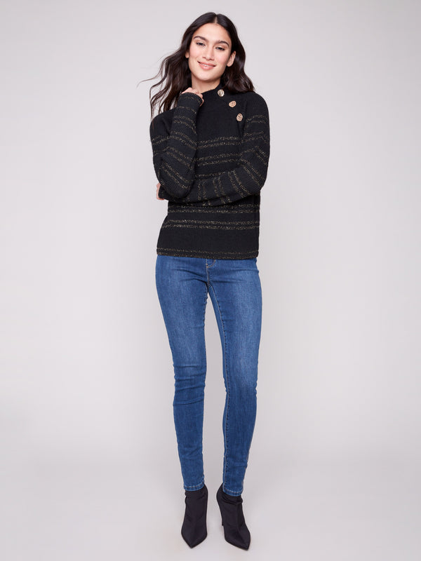 Stylish black sweater with button details at the neck, complemented by shimmering gold metallic stripes by Charlie B.