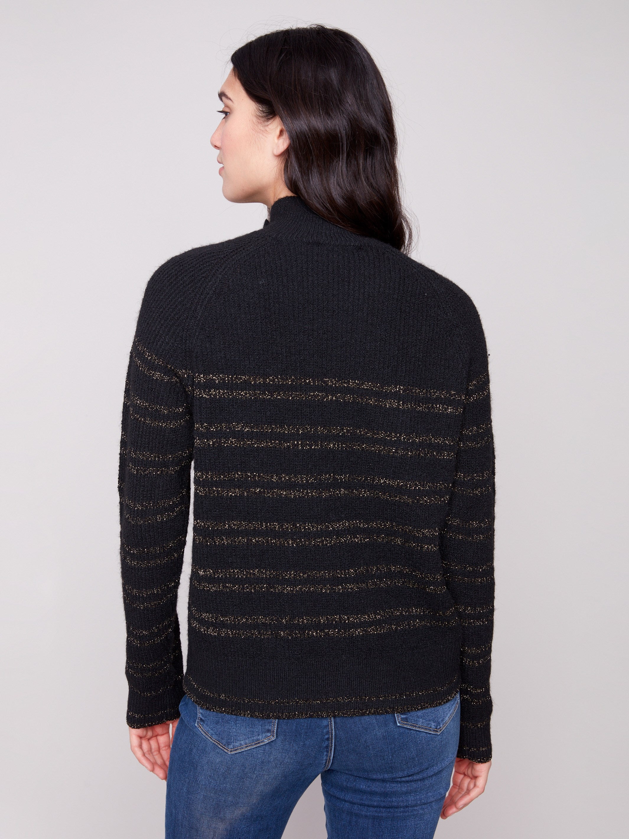 Sophisticated black sweater showcasing raglan sleeves and subtle gold stripes for a refined style by Charlie B.
