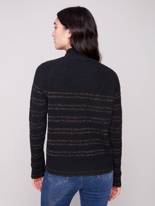 Sophisticated black sweater showcasing raglan sleeves and subtle gold stripes for a refined style by Charlie B.