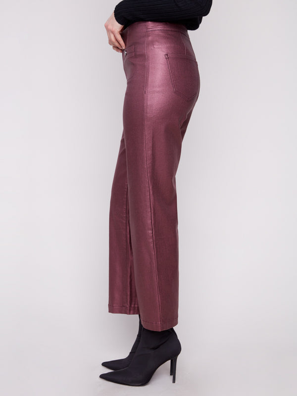 Experience the perfect blend of fashion with stretch fabric in these cabernet metallic flared pants by Charlie B.