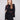 Black sweater featuring a mock neck and floral soutache embroidery, highlighting its relaxed fit by Charlie B.