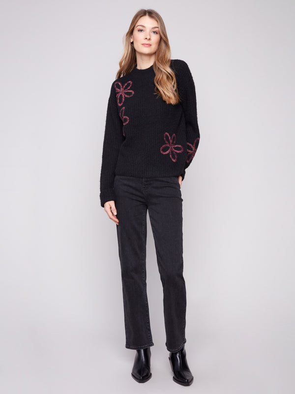 Elegant black sweater with floral soutache details and wide cuffs for a stylish look by Charlie B.