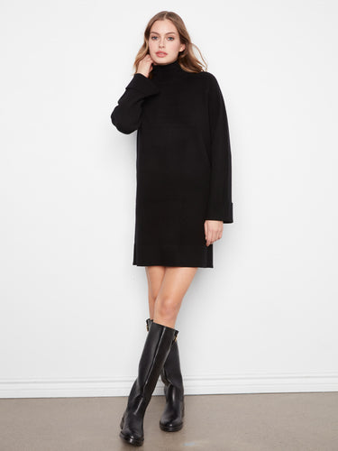 Sophisticated black mini sweater dress with long raglan sleeves, offering both comfort and style in one piece by Charlie B.