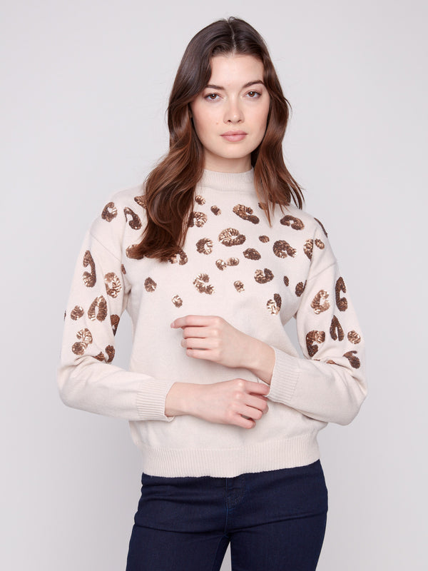 Sweater adorned with leopard pattern in sequins, adding a chic touch to your look by Charlie B.