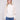 Ecru sweater with a sophisticated mock neck, emphasizing its chic and contemporary style by Charlie B.