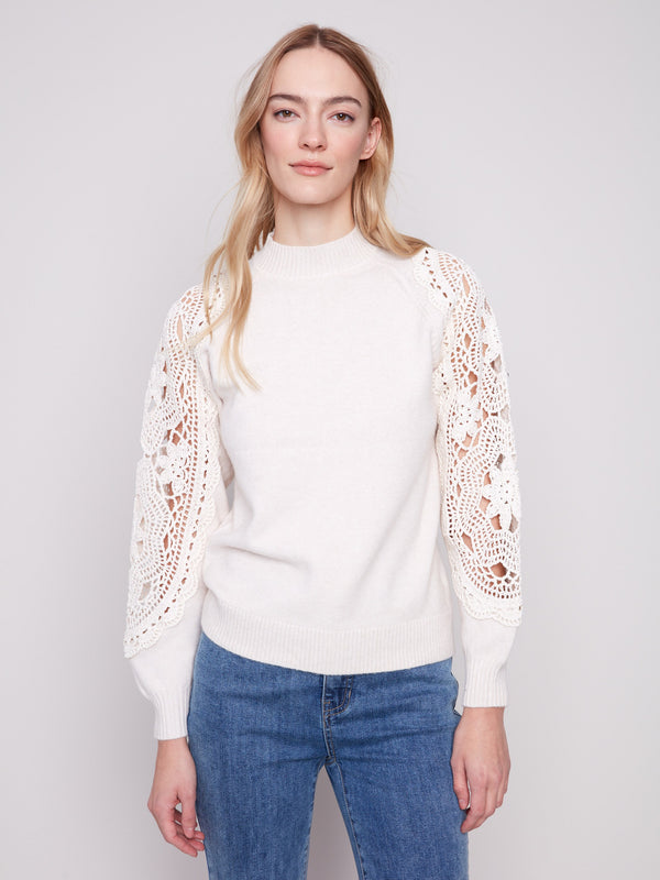 Ecru sweater with a sophisticated mock neck, emphasizing its chic and contemporary style by Charlie B.