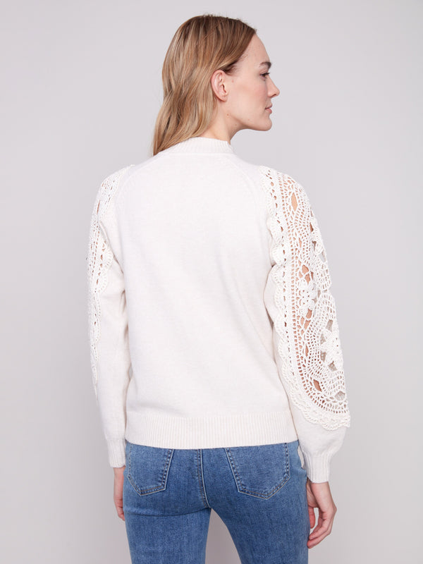 Chic ecru sweater with ribbed cuffs, offering a refined finish to the overall design by Charlie B.