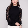 Elegant black sweater featuring a mock neck, perfect for a chic and modern look by Charlie B.
