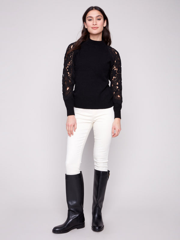 Stylish sweater with crochet sleeves adds a touch of sophistication to any outfit by Charlie B.