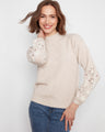Heather-Almond sweater featuring drop shoulders and floral embroidery on the sleeves for a relaxed look by Charlie B.