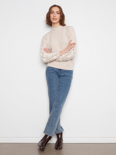 Lightweight Heather-Almond sweater showcasing charming floral sleeve details and drop shoulders by Charlie B.