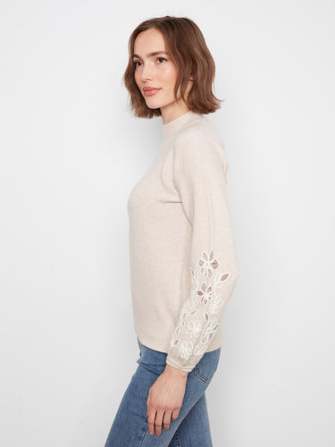 Brown mock neck sweater adorned with beautiful floral embroidered sleeves, perfect for a cozy day by Charlie B.