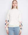 Sweater features a mock neckline, adding a touch of elegance to its casual style. Embroidered floral sleeves enhance its charm by Charlie B.
